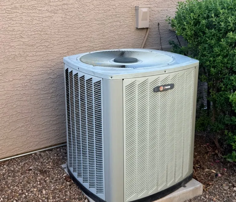 Before: Old condenser replaced with a new high-efficiency American Standard system