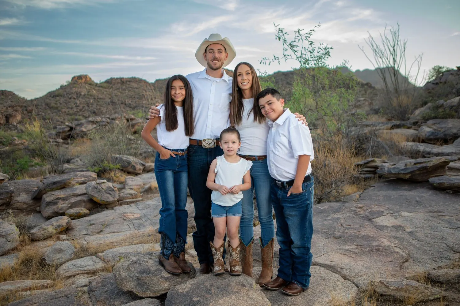 Brandon Sill and his family, owners of Arctic Cowboy, in the Tucson desert