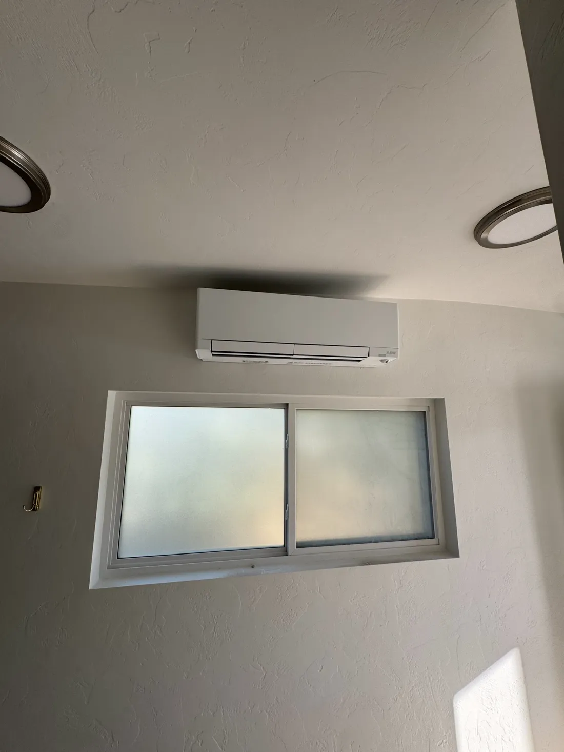 Ductless mini-split installed on a wall by Arctic Cowboy